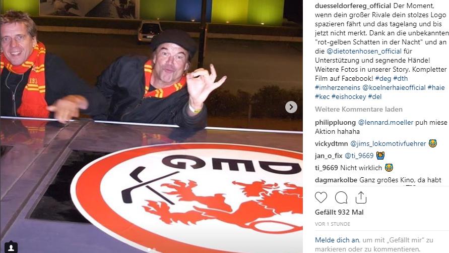 Derby-Streich: Campino beklebt Bus der Kölner Haie mit Wappen der Düsseldorfer EG Streich gelungen: Die Toten Hosen-Sänger Campino beklebt den Bus der Kölner Haie mit dem Logo der Düsseldorfer EG
